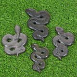 Obsidian snake carving