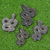 Obsidian snake carving