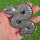 Obsidian snake carving