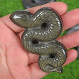 Obsidian snake carving
