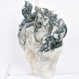 Moss agate with druzy dragon carving