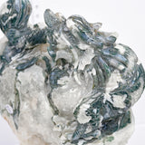 Moss agate with druzy dragon carving