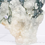 Moss agate with druzy dragon carving