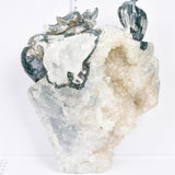 Moss agate with druzy dragon carving