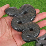 Obsidian snake carving