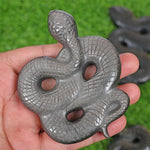 Obsidian snake carving