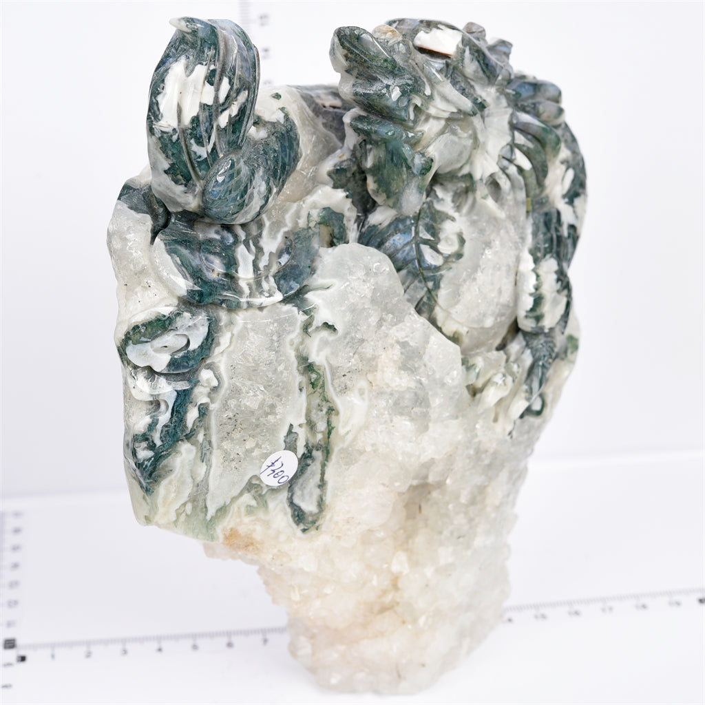 Moss agate with druzy dragon carving