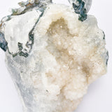 Moss agate with druzy dragon carving